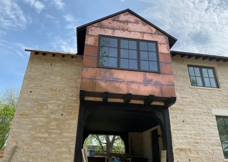Copper metal panel facade on a stone building for Skylight Installation in Murfreesboro